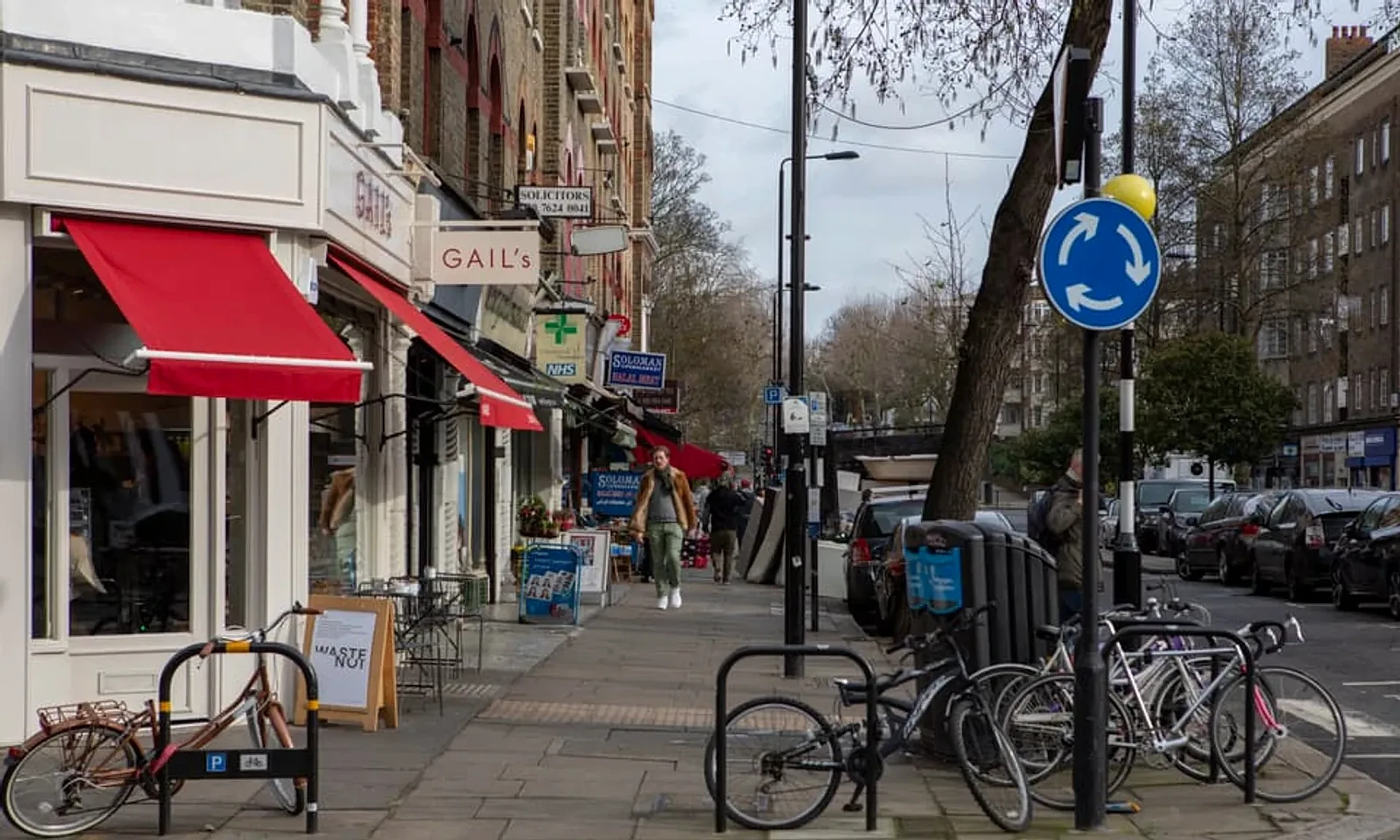 Local shops on a tree-lined street in Maida Vale